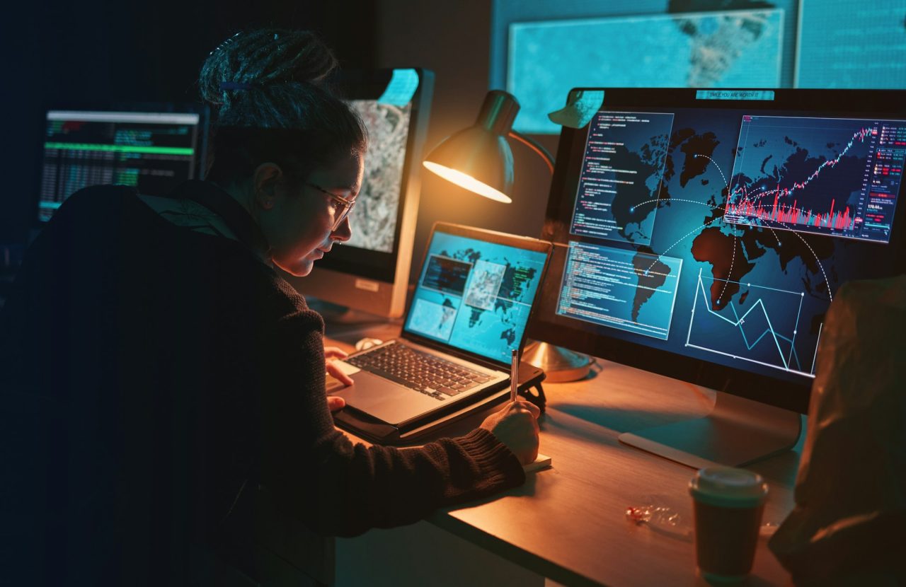 cybersecurity woman and writing global location info with map graphic for phishing and hacker data 1 PlanetGuard AI
