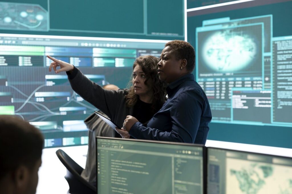 governmental hackers analyzing cyber threats on big screens PlanetGuard AI